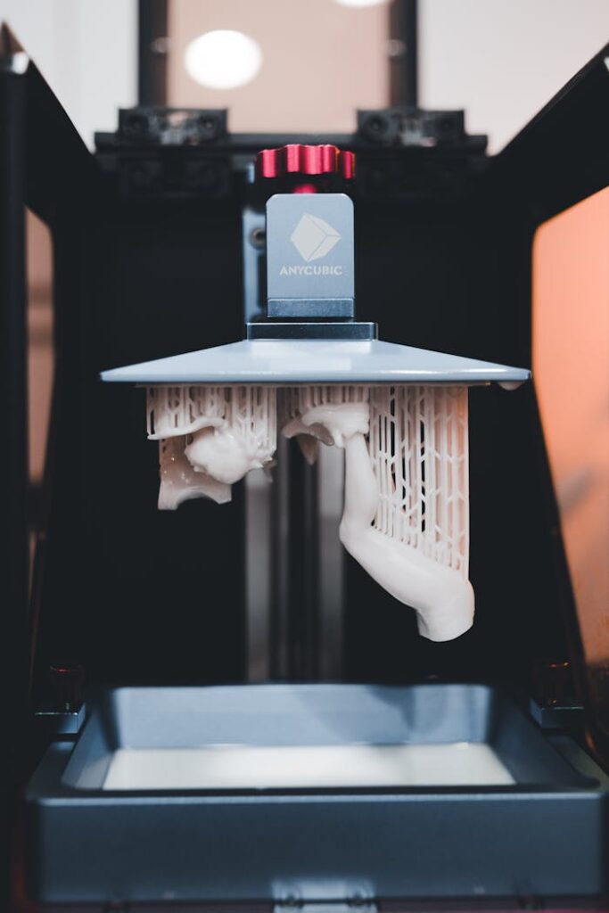 pexels photo 12268465 High-quality close-up of a 3D printer printing an object with resin.